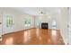 Hardwood floor living room with fireplace and French doors at 909 Shinnville Rd, Mooresville, NC 28115
