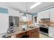 Modern kitchen with stainless steel appliances and an island at 909 Shinnville Rd, Mooresville, NC 28115