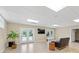 Spacious basement recreation area with double doors leading outside at 909 Shinnville Rd, Mooresville, NC 28115
