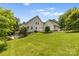 House exterior showcasing backyard patio and lawn at 909 Shinnville Rd, Mooresville, NC 28115