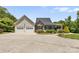 Two-car garage and the front of a charming house at 909 Shinnville Rd, Mooresville, NC 28115