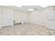 Basement laundry room with stackable washer and dryer at 909 Shinnville Rd, Mooresville, NC 28115
