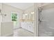 Bathroom with double vanity, shower, and tiled floors at 909 Shinnville Rd, Mooresville, NC 28115