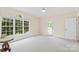 Bright bedroom with backyard access and plush carpeting at 909 Shinnville Rd, Mooresville, NC 28115