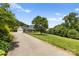 Long driveway leading to a charming house with a two-car garage at 909 Shinnville Rd, Mooresville, NC 28115