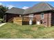 Brick home with large deck and grassy backyard at 115 Anson Dr, China Grove, NC 28023