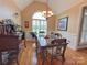 Bright dining room features a large window, chandelier, and hardwood floors at 115 Anson Dr, China Grove, NC 28023