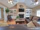 Spacious living room with hardwood floors, a fireplace and built in shelving at 115 Anson Dr, China Grove, NC 28023