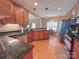 Modern kitchen with granite countertops, wood cabinets and stainless steel appliances at 115 Anson Dr, China Grove, NC 28023
