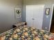 Bright bedroom with floral bedding and double door closet at 115 Anson Dr, China Grove, NC 28023