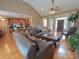 Open living room with hardwood floors, kitchen view and high ceilings at 115 Anson Dr, China Grove, NC 28023