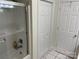 Bathroom with shower/tub combo, linen closet, and double doors at 115 Anson Dr, China Grove, NC 28023