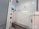 Spacious walk-in shower with subway tile and built-in seat at 115 Anson Dr, China Grove, NC 28023