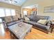 Open living room with hardwood floors, kitchen view and high ceilings at 115 Anson Dr, China Grove, NC 28023