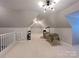 Spacious bonus room with carpeted floor and ample natural light at 115 Anson Dr, China Grove, NC 28023