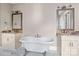 Bathroom with double vanity, soaking tub, and marble floors at 101 Mcalway Rd, Charlotte, NC 28211