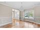 Bright dining room with hardwood floors and chandelier at 101 Mcalway Rd, Charlotte, NC 28211