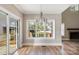 Breakfast nook with hardwood floors, a chandelier, and backyard access at 101 Mcalway Rd, Charlotte, NC 28211