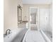 Bathroom with double vanity, soaking tub and marble floors at 101 Mcalway Rd, Charlotte, NC 28211