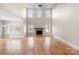 Great room with hardwood floors, high ceilings, and a fireplace at 101 Mcalway Rd, Charlotte, NC 28211