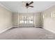 Bright bedroom with carpet, ceiling fan, and large windows at 101 Mcalway Rd, Charlotte, NC 28211