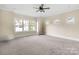 Well-lit bedroom with carpet flooring and a ceiling fan at 101 Mcalway Rd, Charlotte, NC 28211