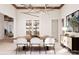 Bright dining room features a wood table, modern chandelier, and wine storage at 108 Sail High Ct, Mooresville, NC 28117