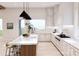 Elegant kitchen boasts modern cabinetry, large island, and a stunning view at 108 Sail High Ct, Mooresville, NC 28117