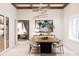 Bright dining room features a wood table, modern chandelier, and wine storage at 108 Sail High Ct, Mooresville, NC 28117