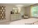 Bedroom with dresser and chair, featuring neutral decor at 4552 Potters Wheel Dr, Fort Mill, SC 29715