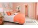 Bright bedroom with a queen-size bed and orange accents at 4552 Potters Wheel Dr, Fort Mill, SC 29715