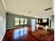 Open concept living room, hardwood floors, view of kitchen and backyard at 422 Bougainvillea Ct, Monroe, NC 28110