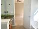 Bathroom with vanity, view of bedroom, and tub at 422 Bougainvillea Ct, Monroe, NC 28110