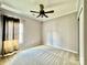 Bedroom with window, ceiling fan, and neutral decor at 422 Bougainvillea Ct, Monroe, NC 28110