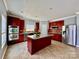 Spacious kitchen with island, stainless steel appliances, and dark wood cabinets at 422 Bougainvillea Ct, Monroe, NC 28110