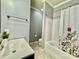 Bathroom with tub, shower, and floral shower curtain at 422 Bougainvillea Ct, Monroe, NC 28110