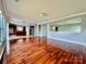 Open living room, hardwood floors, kitchen and staircase views at 422 Bougainvillea Ct, Monroe, NC 28110