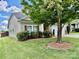 House exterior with green lawn and trees at 422 Bougainvillea Ct, Monroe, NC 28110