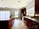 Eat-in kitchen with an island, stainless steel appliances, and ample counter space at 422 Bougainvillea Ct, Monroe, NC 28110