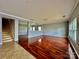 Hardwood floors, open concept living space, and staircase at 422 Bougainvillea Ct, Monroe, NC 28110
