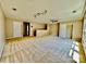 Bonus room with ample space, ceiling fan, and multiple windows at 422 Bougainvillea Ct, Monroe, NC 28110