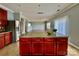 Kitchen with island, stainless steel appliances, and wood cabinets at 422 Bougainvillea Ct, Monroe, NC 28110