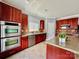 Modern kitchen with stainless steel appliances and wood cabinets at 422 Bougainvillea Ct, Monroe, NC 28110