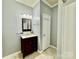 Bathroom features vanity, mirror, and linen closet at 422 Bougainvillea Ct, Monroe, NC 28110