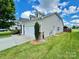 Side view of house showing garage and landscaping at 422 Bougainvillea Ct, Monroe, NC 28110