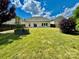 Nice backyard with a large tree and garden at 422 Bougainvillea Ct, Monroe, NC 28110