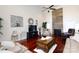 Spacious living room with hardwood floors, a stone fireplace, and comfortable seating at 3617 Venetian Way, York, SC 29745