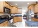 Kitchen with light wood cabinets, granite countertops, and stainless steel appliances at 3617 Venetian Way, York, SC 29745
