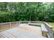 Relaxing deck with built-in bench and wooded backdrop at 3617 Venetian Way, York, SC 29745