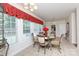 Charming breakfast nook boasts a glass-top table and built-in window seating at 3617 Venetian Way, York, SC 29745